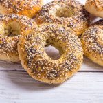 A bagel is characterized by a shiny, tough crust and a chewy crumb.