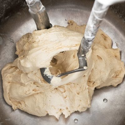 A dough with a higher water absorption stretches easily and has good pan flow.