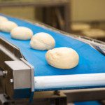 Dough moulding is the final step of the makeup stage in high-speed production of pan or loaf-type bread.