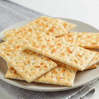 Crackers are baked goods characterized by their low moisture content, hard bite and long shelf-life.