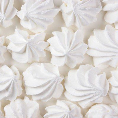A meringue is made by whipping egg whites with sugar into a stiff foam or frothy mixture.