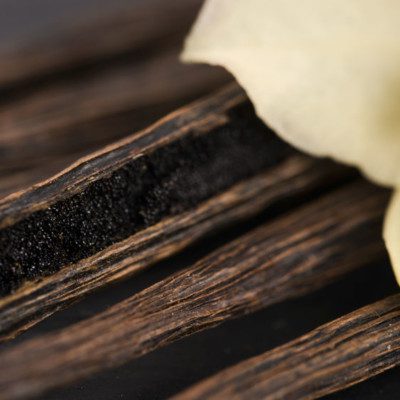 Vanilla extract, from vanilla bean pods, is used as a flavor enhancer in baking.