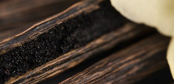Vanilla extract, from vanilla bean pods, is used as a flavor enhancer in baking.