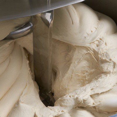 Bread dough in a metal mixing bowl - Stock Image - F016/4152 - Science  Photo Library