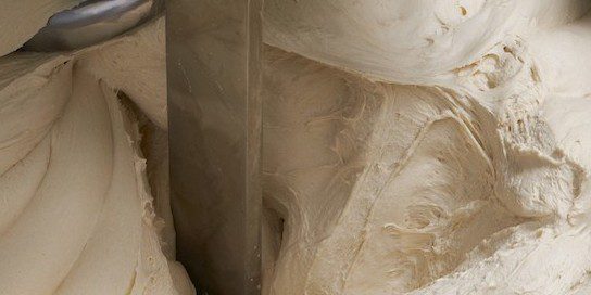 The goal of dough mixing is to mechanically create a humongous dough.