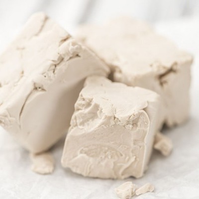  Compressed yeast is a fresh cream yeast that has been drained from most of its water and compressed into small blocks. This yeast is the most common form of commercial baker’s yeast. 