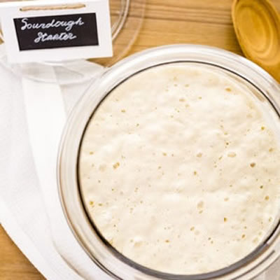 The sourdough starter or levain is simply combined by flour and water and left to sit or ferment.